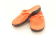 bright orange slippers on white background
