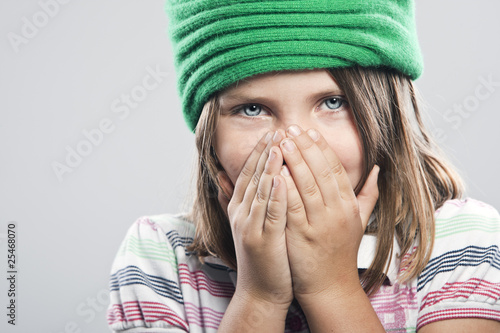 Photo: Cute Child Covering her Mouth and Nose Cute Child Covering her Mouth and Nose