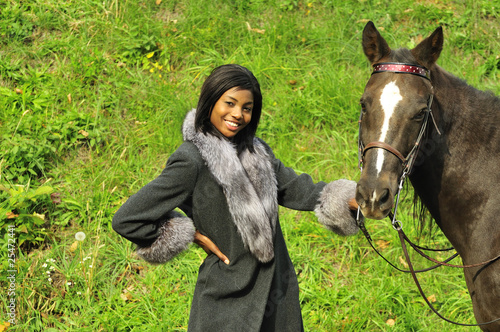 Photo: woman posing with a horse woman posing with a horse