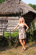 Beautiful blond young woman in the village