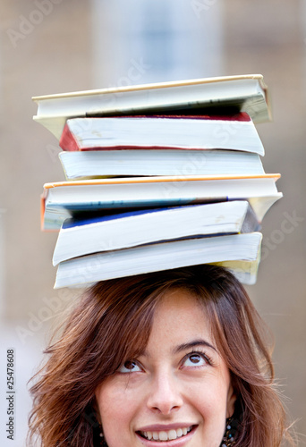 Woman balancing books Woman balancing books