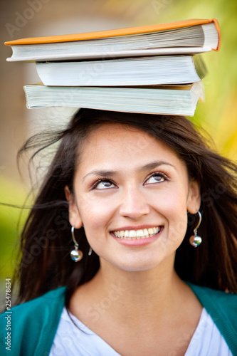 Woman balancing books Woman balancing books