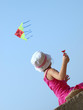 Little child playing with a kite
