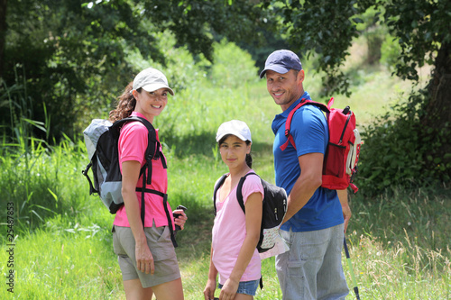 Photo : Family hiking in the countryside Family hiking in the countryside