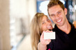 Couple displaying a card
