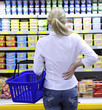 costumer shopping in the supermarket choosing a product