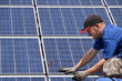 Photo: Workman with solar moduls Workman with solar moduls