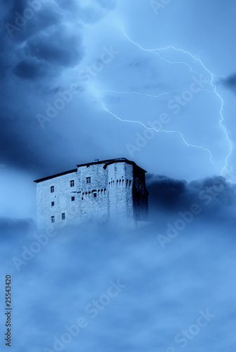Photo: isolated castle shrouded by the fog isolated castle shrouded by the fog