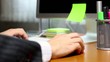 Businessman typing on computer keyboard at office