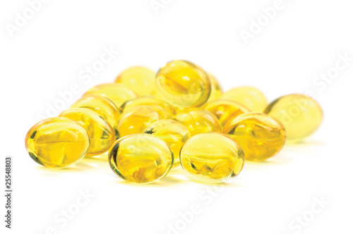 Photo: Yellow Vitamin Oil Capsules Macro Closeup Isolated Yellow Vitamin Oil Capsules Macro Closeup Isolated