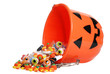 child halloween pumpkin bucket spilling candy