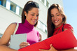 Female college friends talking on campus Female college friends talking on campus