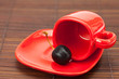 red cup and a cherry on a bamboo mat red cup and a cherry on a bamboo mat