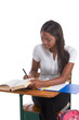 Photo: College student African American woman by desk College student African American woman by desk