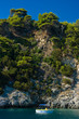 A boat in the rocky coast, Hellenic Republic A boat in the rocky coast, Hellenic Republic