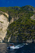 A boat in the rocky coast, Hellenic Republic A boat in the rocky coast, Hellenic Republic