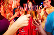 Clinking glasses with champagne