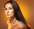 Photo: Fashion portrait in warm tones with golden makeup. Fashion portrait in warm tones with golden makeup.