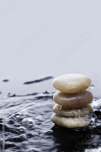 Photo: Stacking river stone with wave. Stacking river stone with wave.