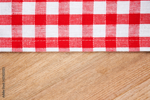 Photo: checkered tablecloth on wooden table checkered tablecloth on wooden table