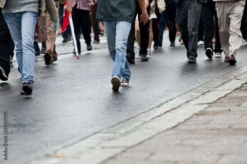 Photo: Crowd walking - group of people walking together (motion blur) Crowd walking - group of people walking together (motion blur)