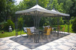 Garden with tent and garden furniture