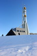 Three-stage space rocket against a blue sky in the winter