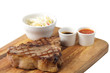 meat and sause on a cutting board meat and sause on a cutting board