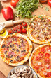 three different kind of pizzas