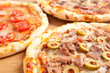 three different kind of pizzas