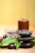 Black spa stones and candles