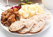 Sliced turkey breast with mashed potatoes and stuffing