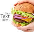 Photo: big cheeseburger held in hands with space for text big cheeseburger held in hands with space for text