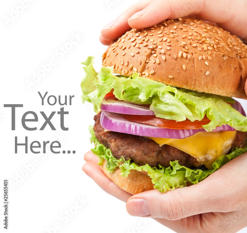 Photo: big cheeseburger held in hands with space for text big cheeseburger held in hands with space for text