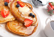 classic pancakes with syrup and berries