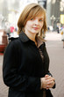 Beautiful young woman walking in the street