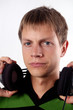 guy keeping headphones close-up