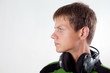 attractive guy with headphones looking outside