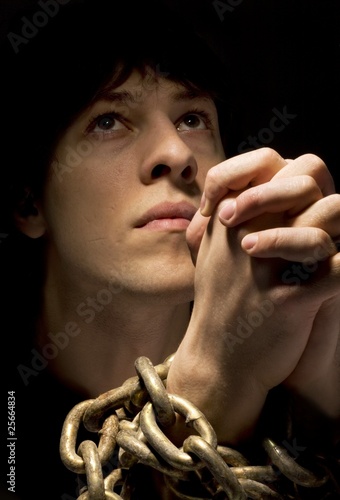 Photo: Man In Chains, Praying Man In Chains, Praying