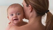 Portrait of mother holding baby
