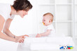 mother playing with baby