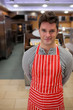 Confident cook smiling at the camera Confident cook smiling at the camera