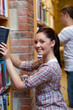 Charming young woman looking for a book Charming young woman looking for a book