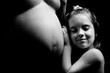 Little girl and pregnant mother Little girl and pregnant mother