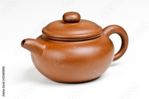 Photo: Clay tea pot on white background Clay tea pot on white background