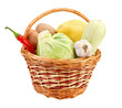 Little basket with vegetables, isolated on white