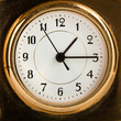 An old fashioned golden clock. Macro An old fashioned golden clock. Macro