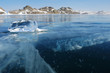 Transparent piece of ice on the surface of frozen lake. Transparent piece of ice on the surface of frozen lake.
