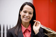 Portrait of a businesswoman carrying her dry cleaning