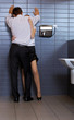 Young business couple in love at office washroom